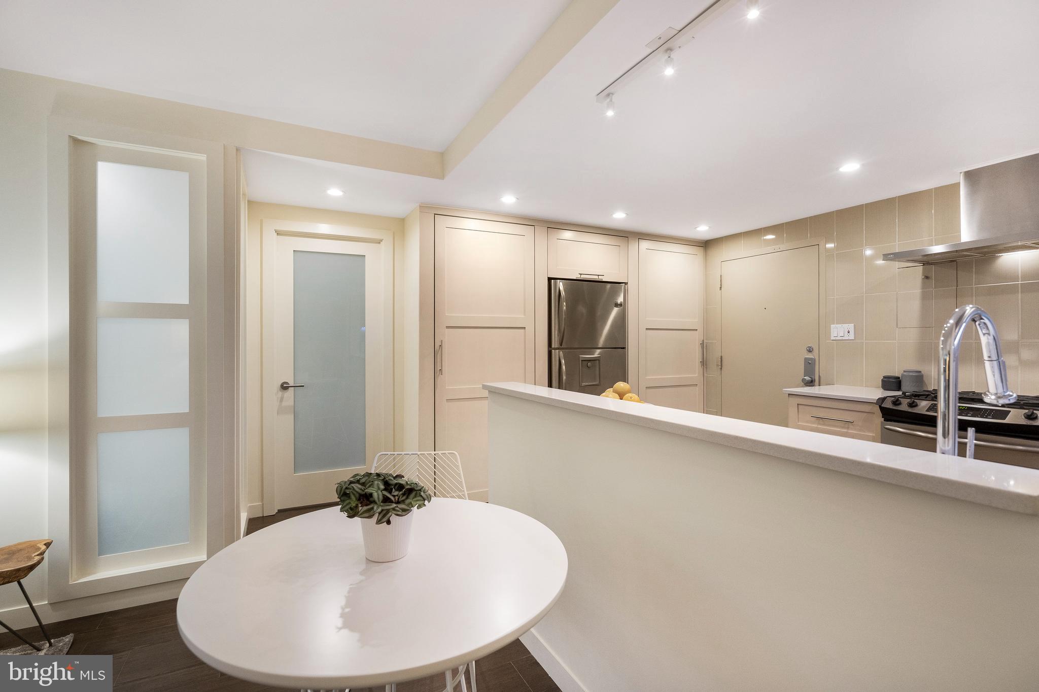 1301 20th Street Northwest, Unit 109 Washington, DC 20036 - Photo 9 of 33 a bathroom with a sink and a mirror