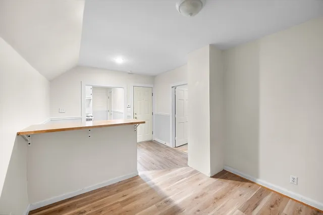 a view of kitchen with wooden floor