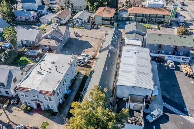 an aerial view of a houses with outdoor space