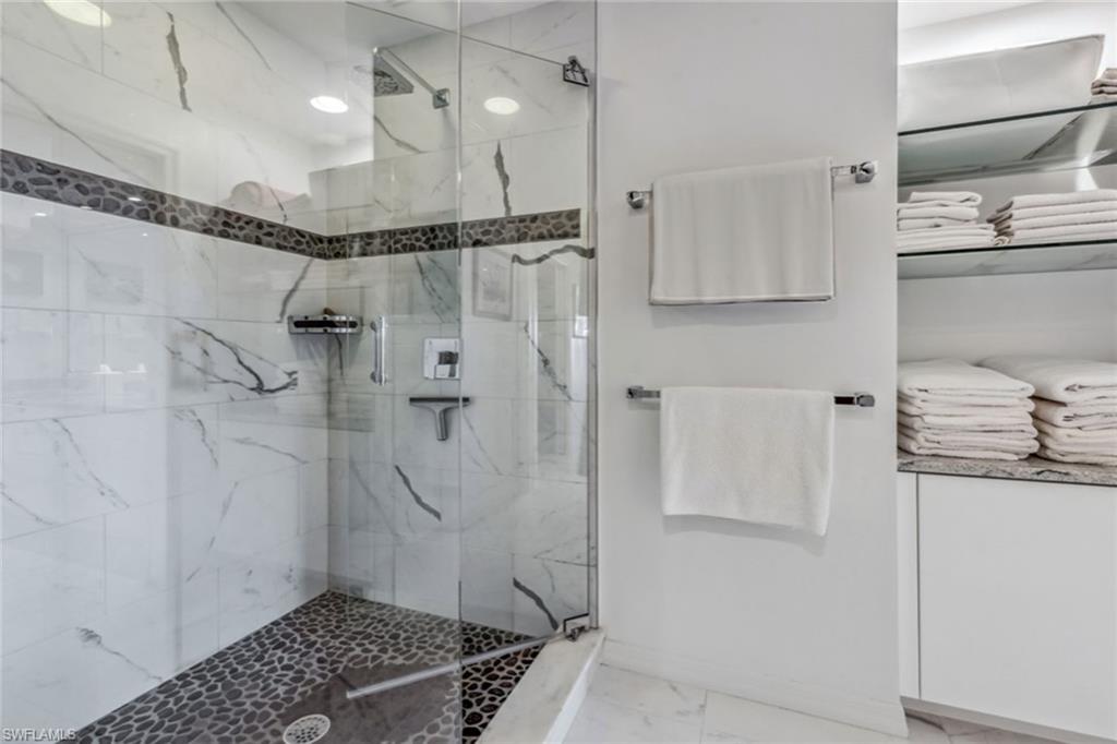 764 Eagle Creek Drive, Unit 301 Naples, FL 34113 - Photo 12 of 31 a bathroom with a shower