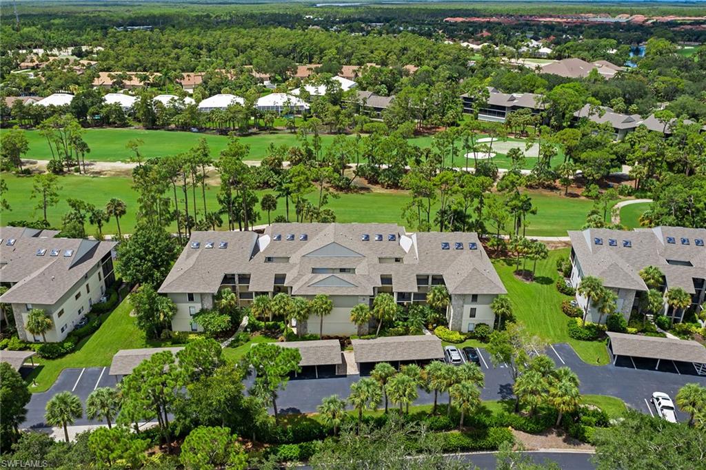 764 Eagle Creek Drive, Unit 301 Naples, FL 34113 - Photo 19 of 31 an aerial view of a house with a yard