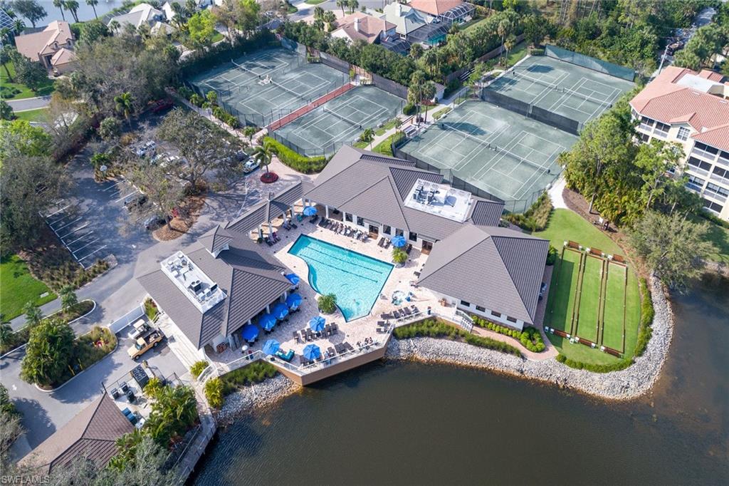 764 Eagle Creek Drive, Unit 301 Naples, FL 34113 - Photo 21 of 31 an aerial view of a house with a garden and swimming pool