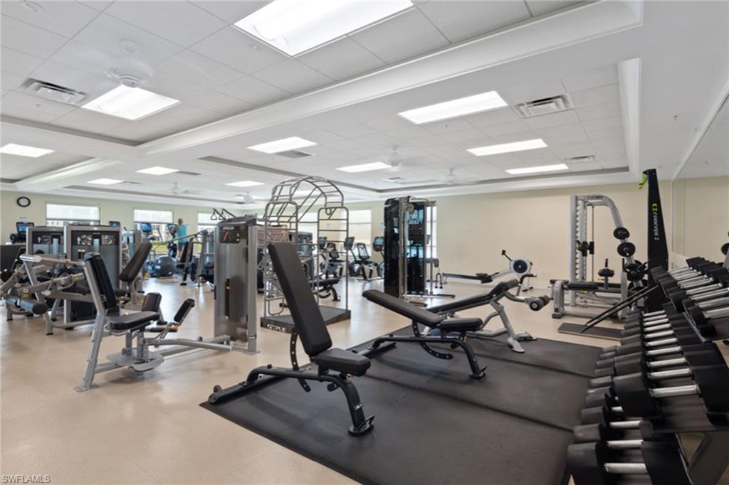 764 Eagle Creek Drive, Unit 301 Naples, FL 34113 - Photo 24 of 31 a view of a room with gym equipment