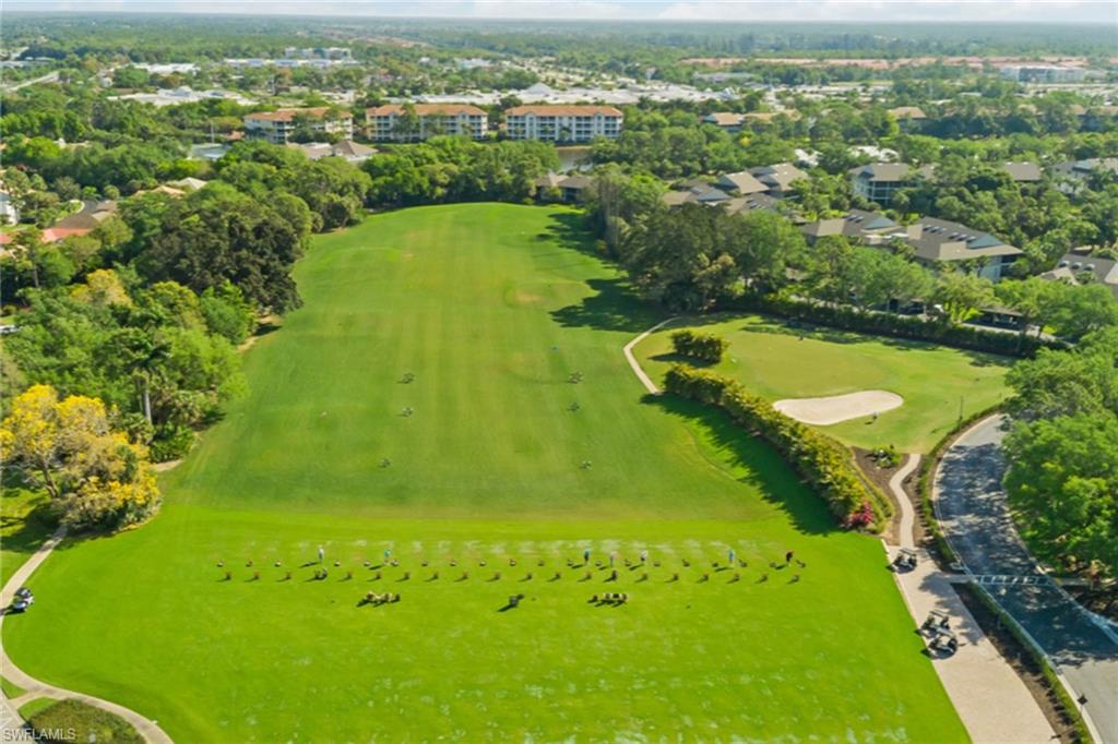 764 Eagle Creek Drive, Unit 301 Naples, FL 34113 - Photo 28 of 31 an aerial view of a residential houses with outdoor space and swimming pool