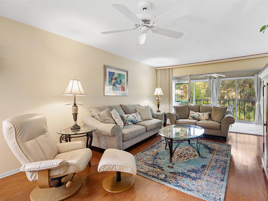 4415 Longmeadow, Unit 44 Sarasota, FL 34235 - Photo 12 of 42 a living room with furniture or couch and a large window