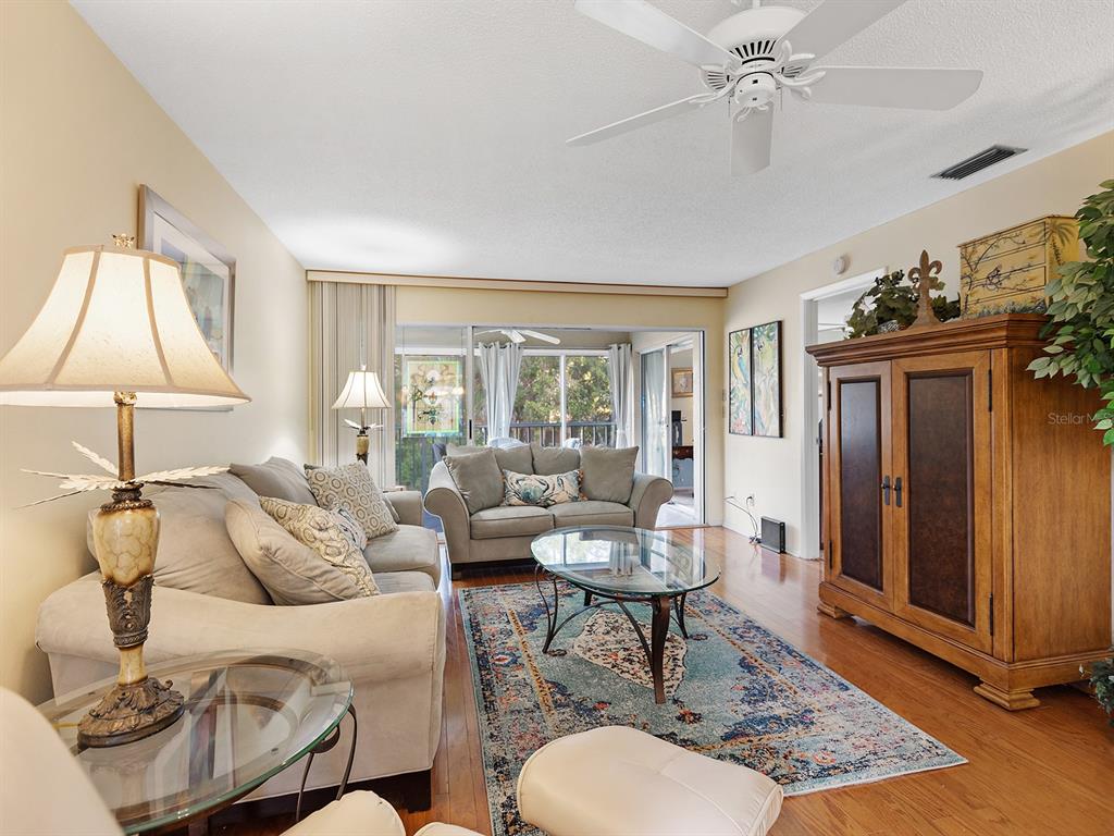 4415 Longmeadow, Unit 44 Sarasota, FL 34235 - Photo 13 of 42 a living room with furniture and a window