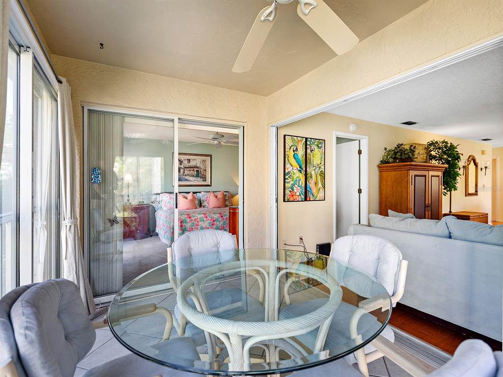 4415 Longmeadow, Unit 44 Sarasota, FL 34235 - Photo 16 of 42 a living room with furniture and a large window