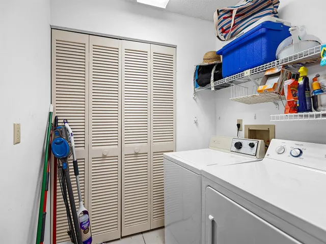 a view of storage and utility room with washer and dryer
