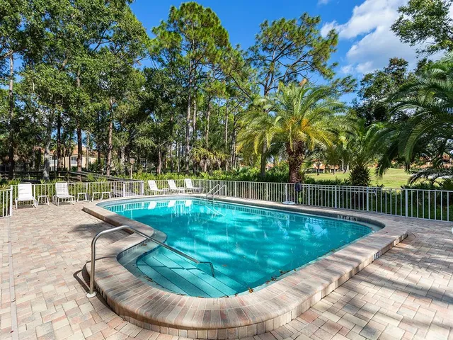 a view of a swimming pool with a patio
