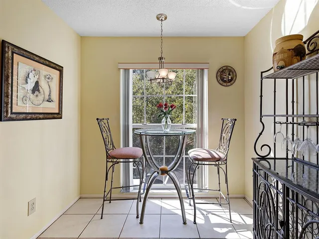 a view of a dining room with furniture window and outside view
