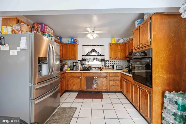 a kitchen with granite countertop stainless steel appliances and cabinets