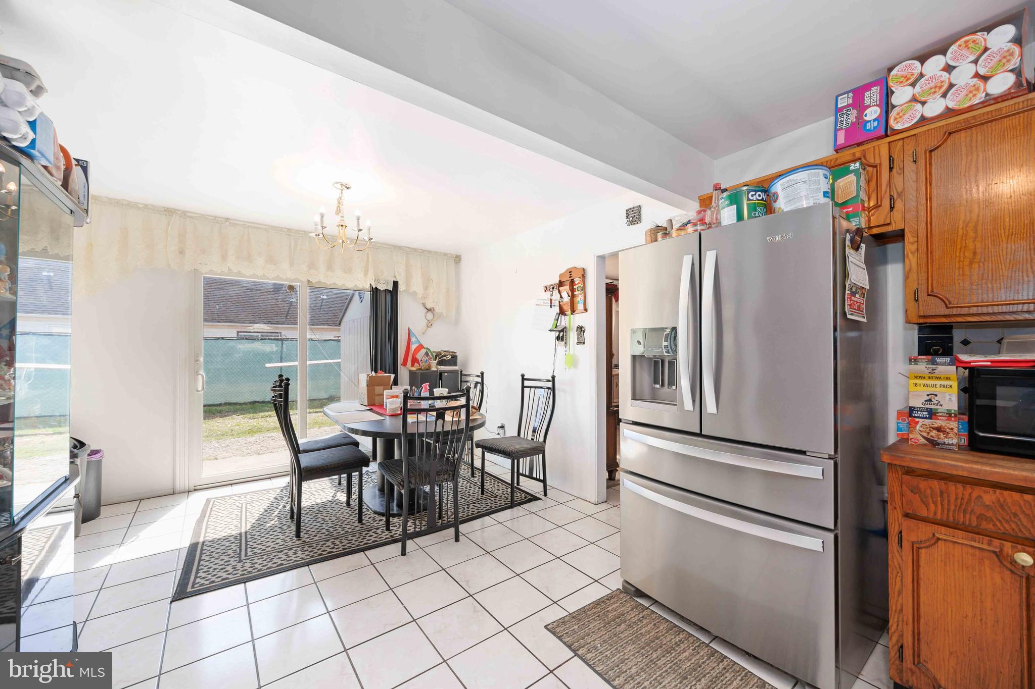 35 Ember Lane Willingboro, NJ 08046 - Photo 16 of 30 a kitchen with stainless steel appliances a refrigerator and a dining table