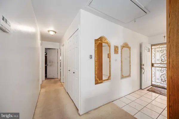 a view of entryway with window and hallway