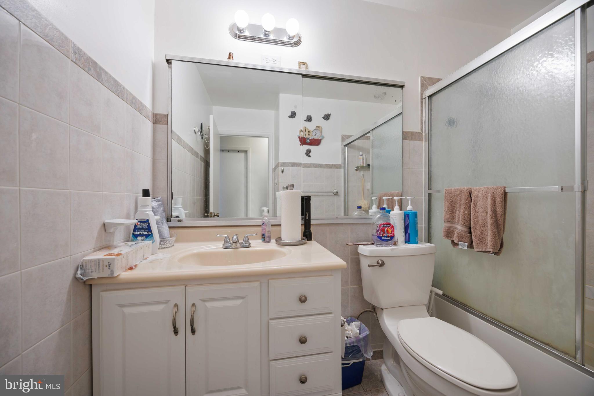 35 Ember Lane Willingboro, NJ 08046 - Photo 23 of 30 a bathroom with a sink vanity mirror and toilet