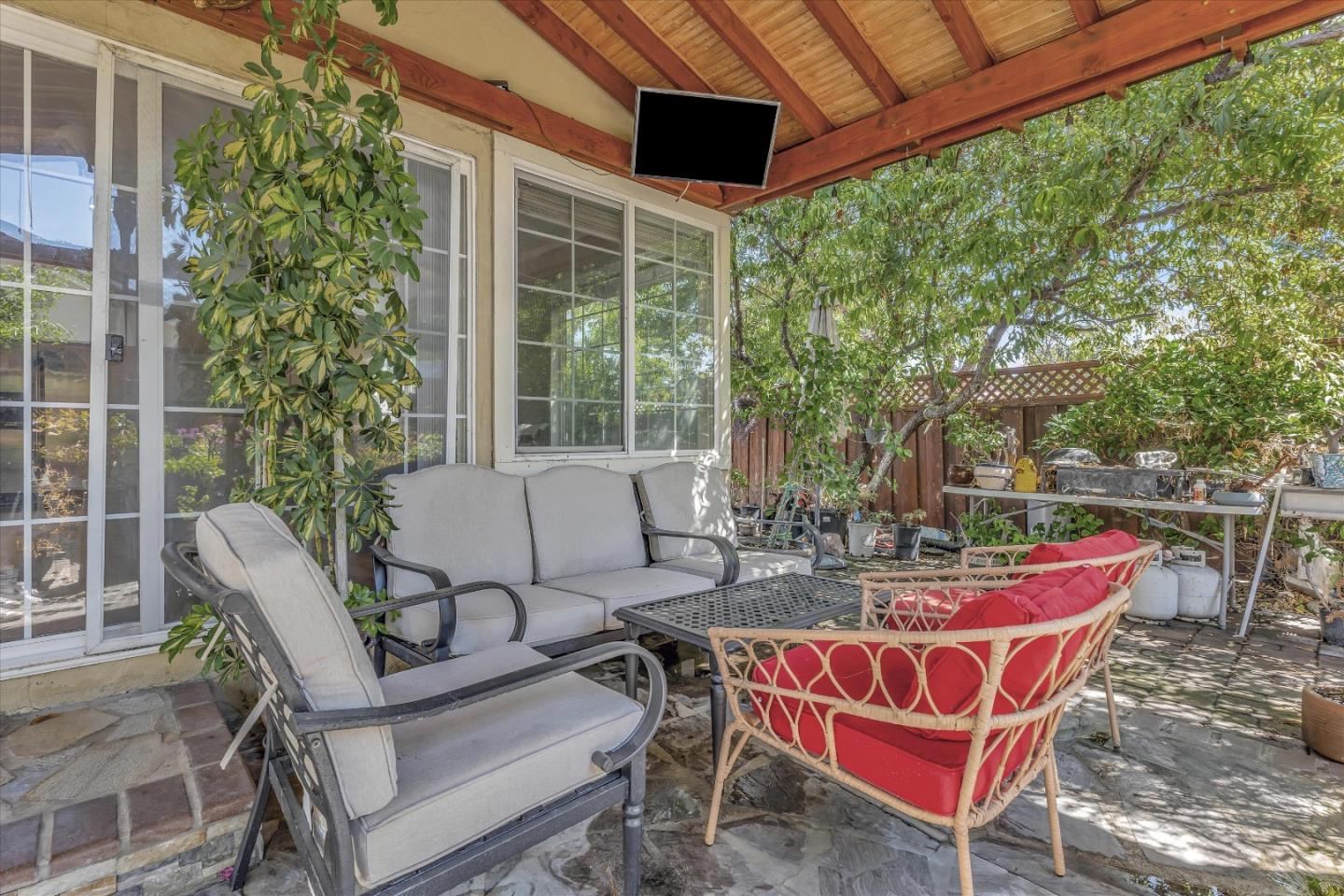 252 Sposito Circle San Jose, CA 95136 - Photo 15 of 50 a view of a patio with table and chairs and potted plants