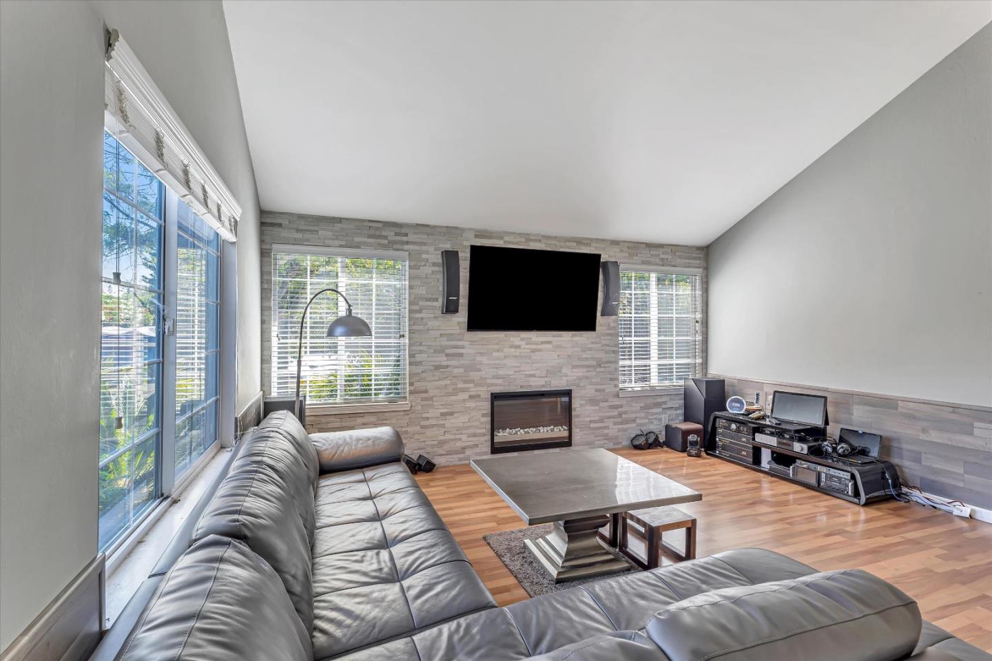 252 Sposito Circle San Jose, CA 95136 - Photo 21 of 50 a living room with furniture fireplace and a flat screen tv