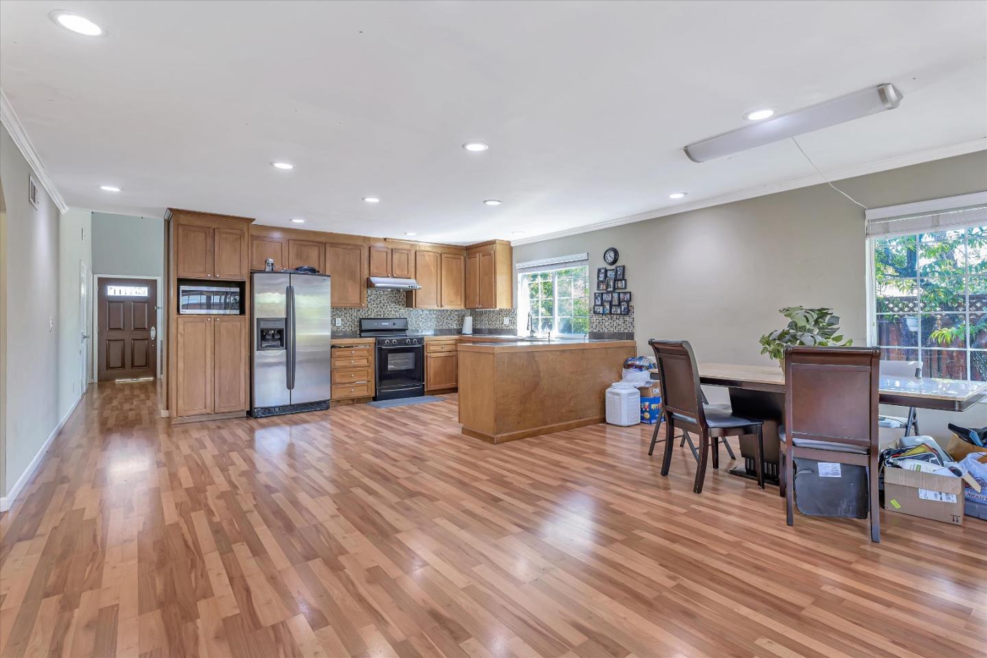 252 Sposito Circle San Jose, CA 95136 - Photo 26 of 50 a living room with stainless steel appliances kitchen island granite countertop furniture wooden floor and a view of kitchen