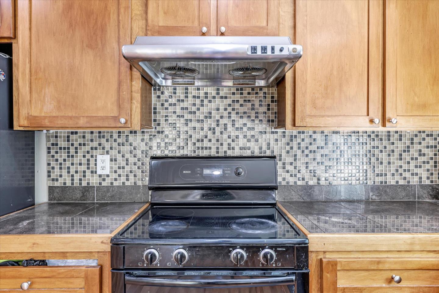 252 Sposito Circle San Jose, CA 95136 - Photo 32 of 50 a kitchen with granite countertop a stove and a sink
