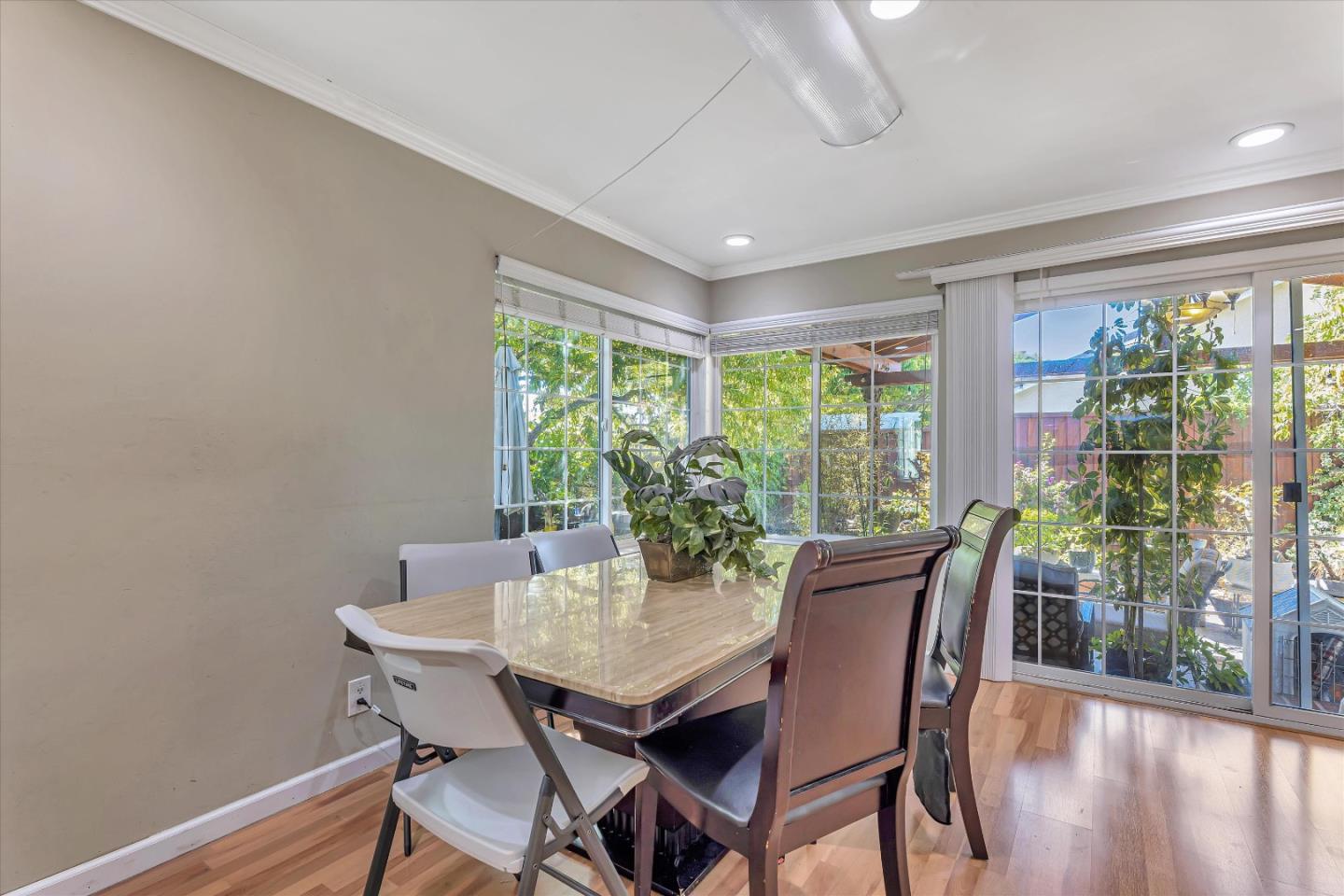 252 Sposito Circle San Jose, CA 95136 - Photo 33 of 50 a view of a dining room with furniture window and wooden floor