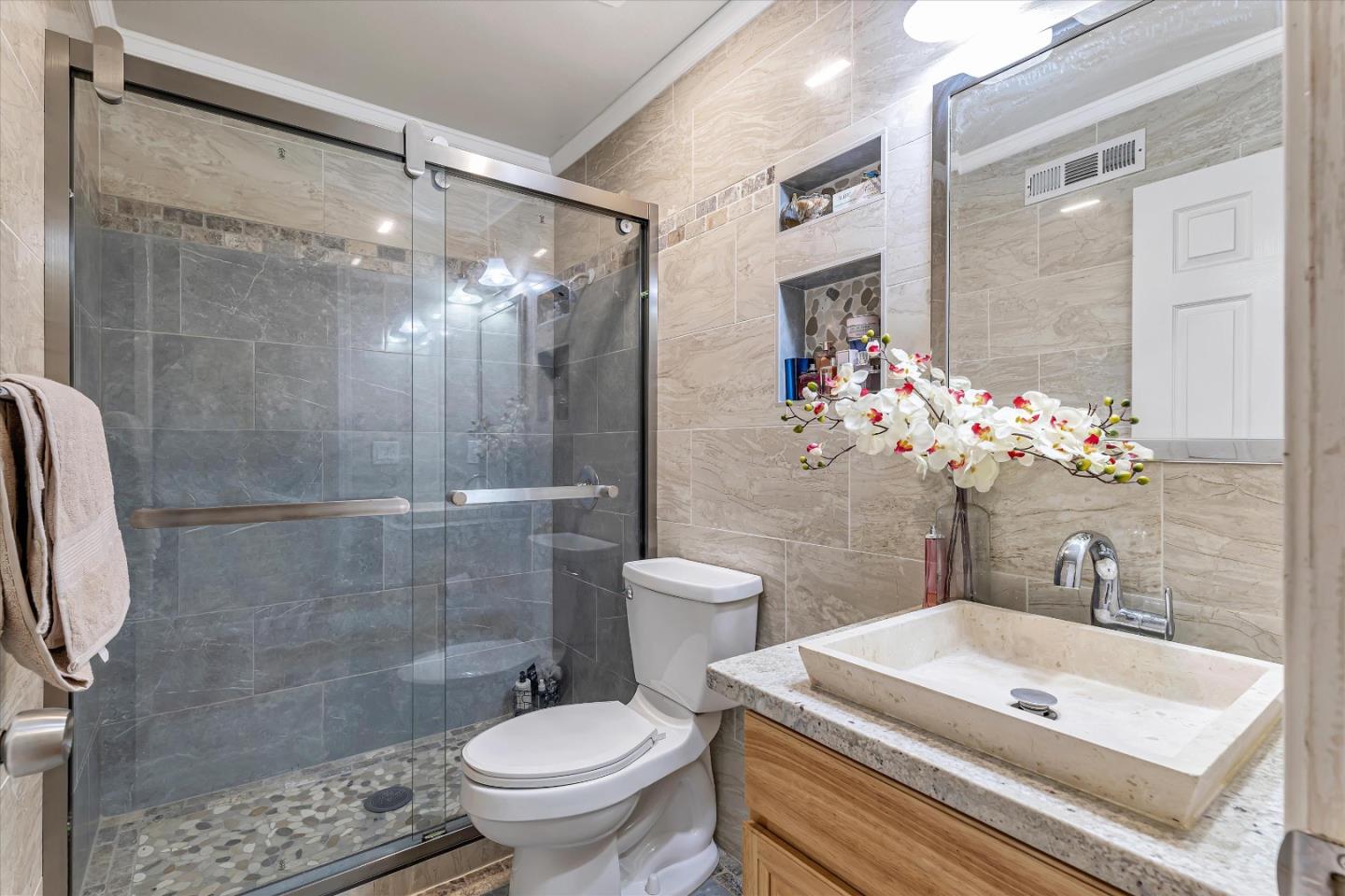 252 Sposito Circle San Jose, CA 95136 - Photo 36 of 50 a bathroom with a sink toilet and shower