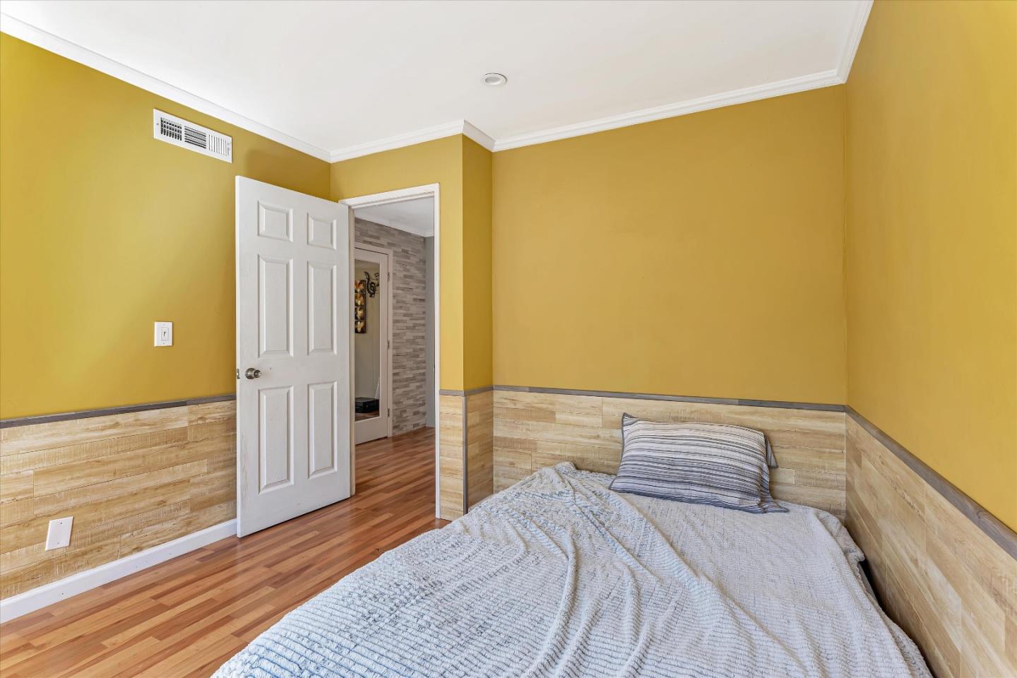 252 Sposito Circle San Jose, CA 95136 - Photo 45 of 50 a bedroom with a bed and wooden floor