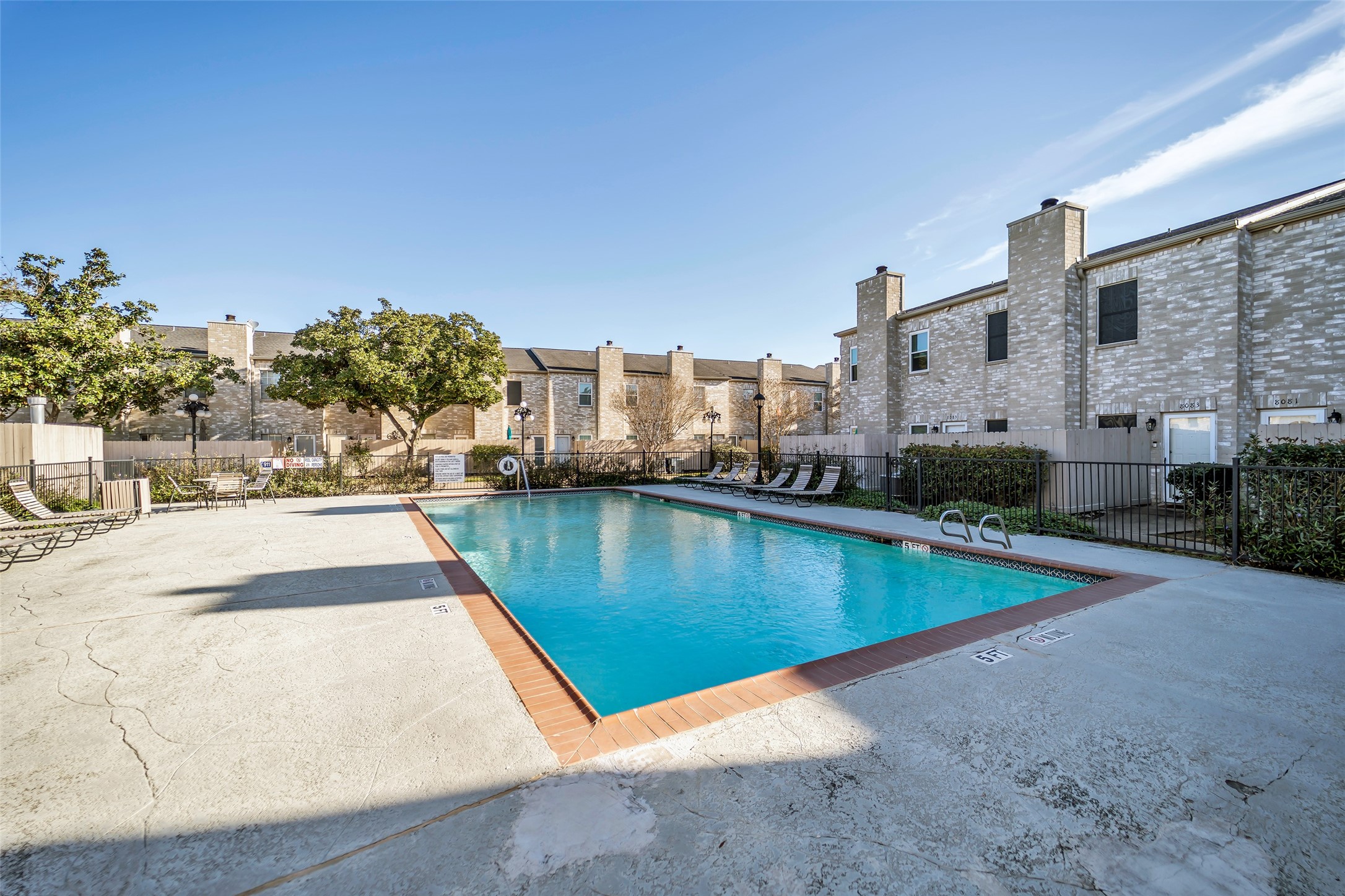 8091 El Mundo Street, Unit 8091 Houston, TX 77054 - Photo 21 of 22 a view of a swimming pool with a yard
