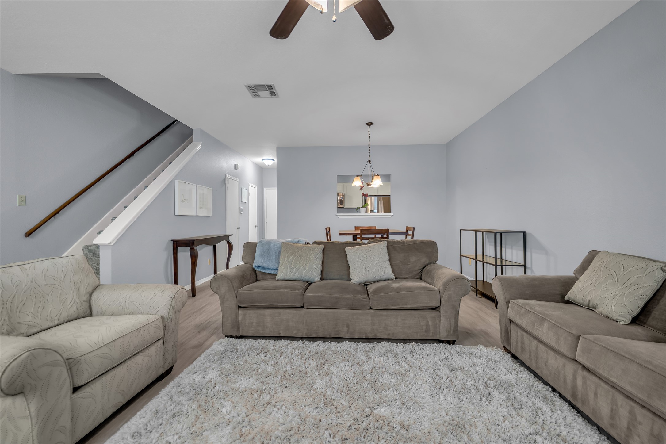 8091 El Mundo Street, Unit 8091 Houston, TX 77054 - Photo 3 of 22 a living room with furniture and a chandelier