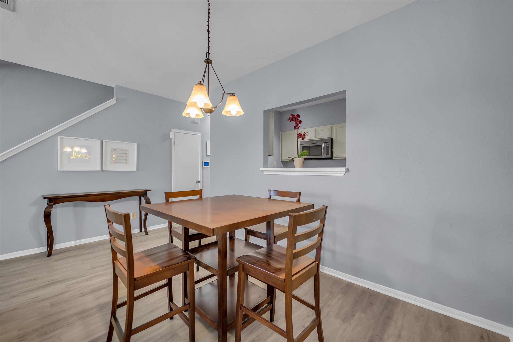 8091 El Mundo Street, Unit 8091 Houston, TX 77054 - Photo 6 of 22 a dining room with a table and chairs