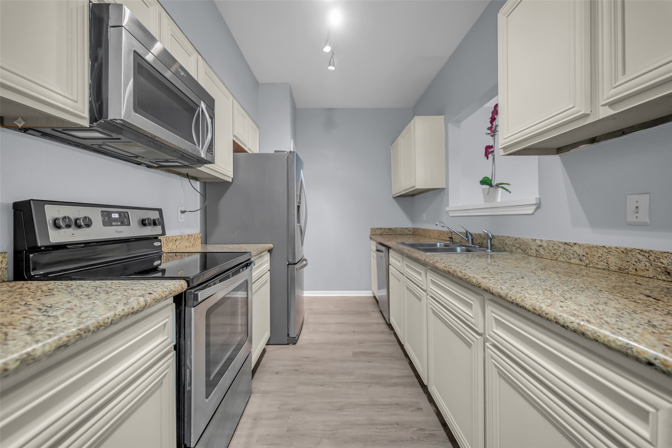 8091 El Mundo Street, Unit 8091 Houston, TX 77054 - Photo 8 of 22 a kitchen with stainless steel appliances granite countertop a stove and a sink