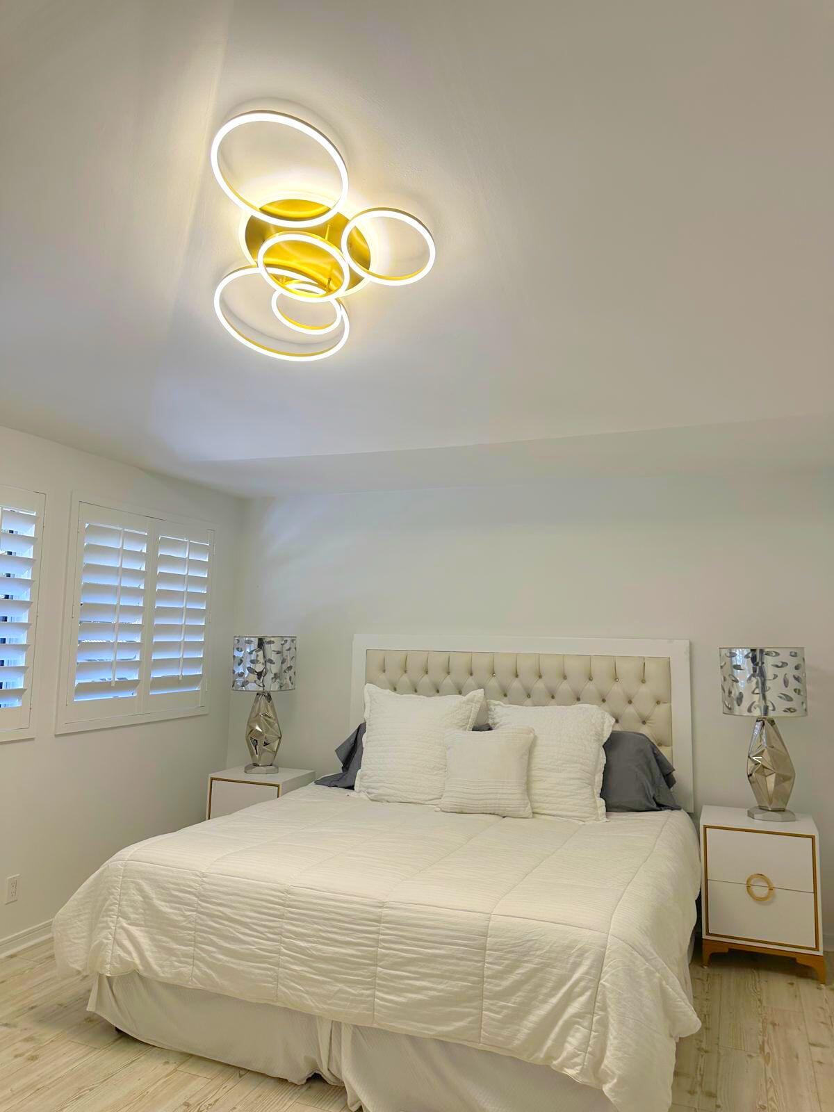2252 Northwest 53rd Street Boca Raton, FL 33496 - Photo 21 of 23 a bedroom with a bed and a window