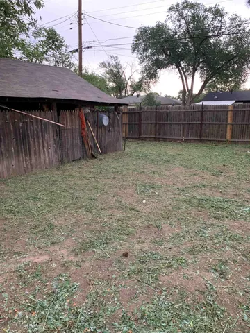 a view of a backyard with a cabin