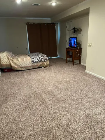 a view of room with furniture and a rug