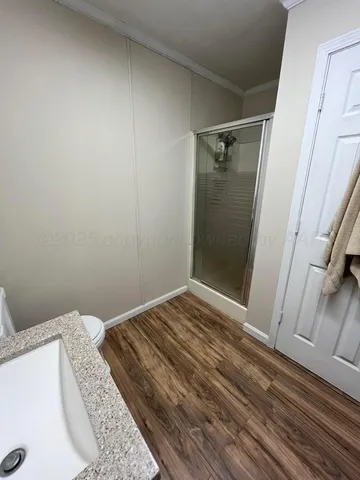 a bedroom with a bed and a rug