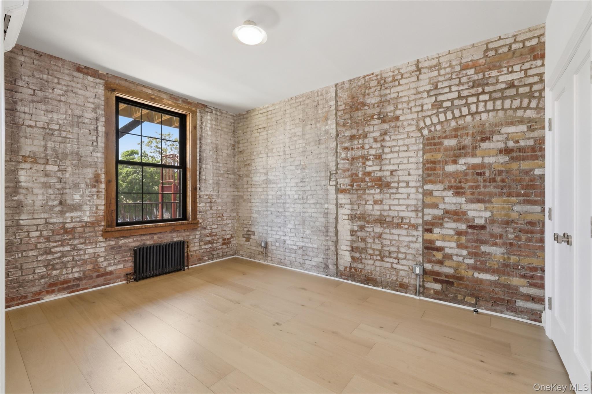 207 Main Street, Unit 5 Beacon, NY 12508 - Photo 13 of 20 a view of an empty room with a window