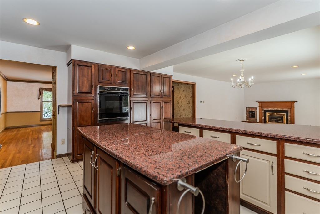 63 Larkspur Drive Amherst, MA 01002 - Photo 11 of 42 a kitchen with kitchen island a sink stove and refrigerator