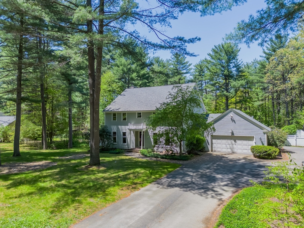 63 Larkspur Drive Amherst, MA 01002 - Photo 2 of 42 a view of house with a yard and potted plants