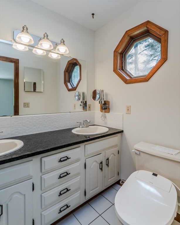 63 Larkspur Drive Amherst, MA 01002 - Photo 25 of 42 a bathroom with a toilet a sink and a mirror