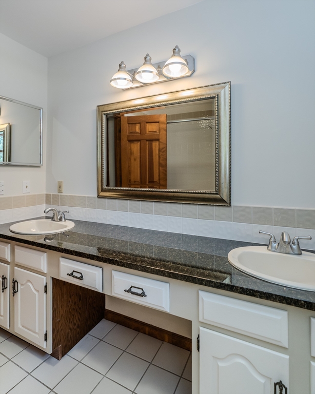 63 Larkspur Drive Amherst, MA 01002 - Photo 30 of 42 a bathroom with a sink and a mirror