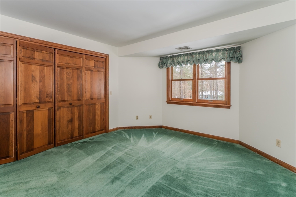 63 Larkspur Drive Amherst, MA 01002 - Photo 32 of 42 a view of an empty room with window and closet