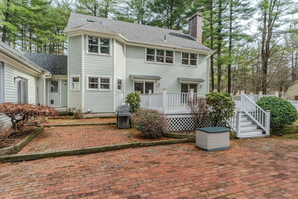 63 Larkspur Drive Amherst, MA 01002 - Photo 38 of 42 a front view of a house with a yard and plants