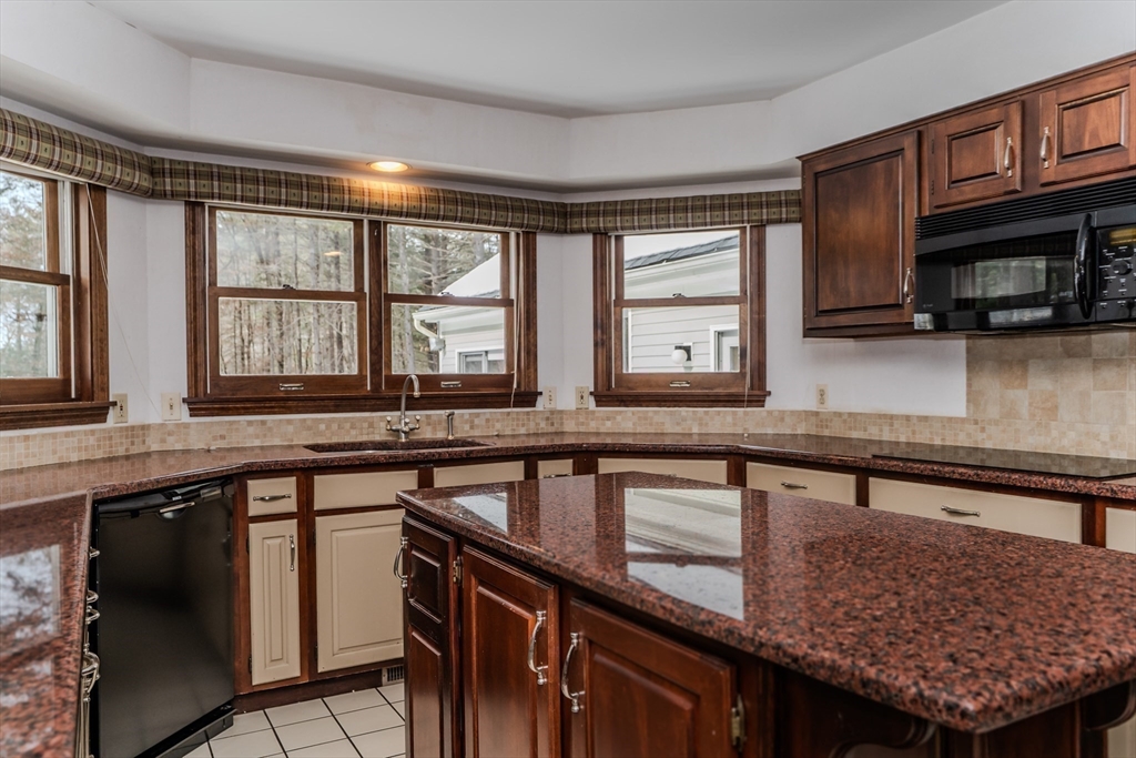 63 Larkspur Drive Amherst, MA 01002 - Photo 10 of 42 a kitchen with stainless steel appliances granite countertop a sink and a stove