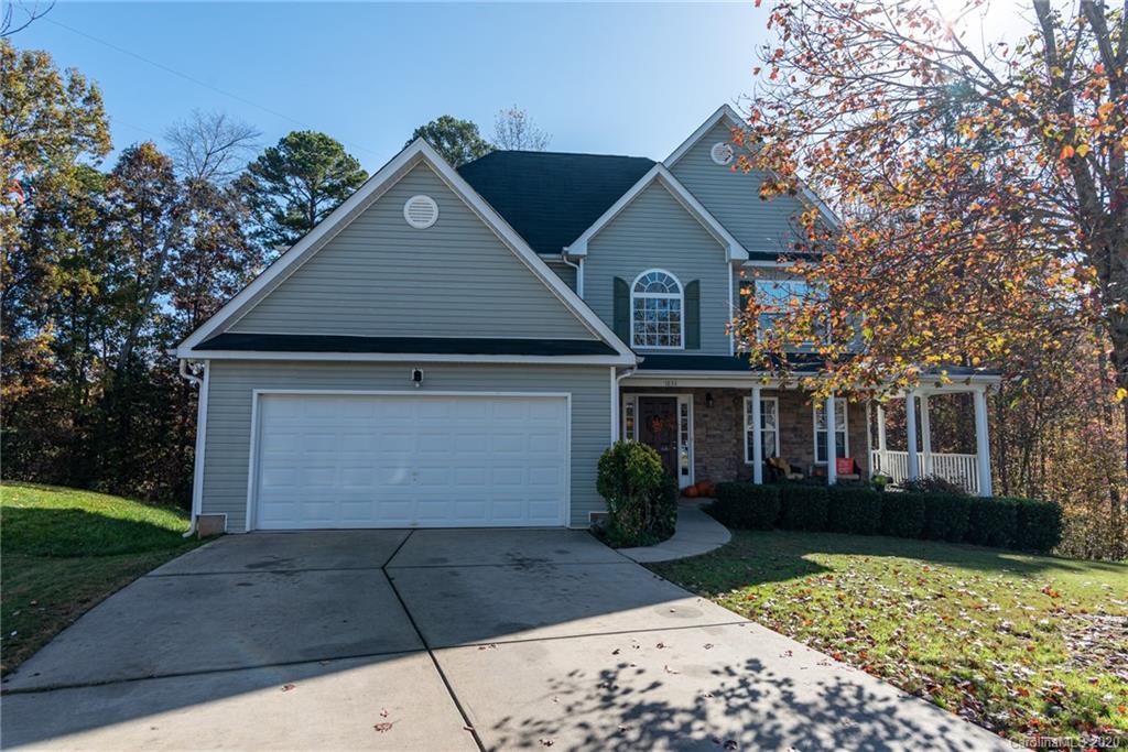 7838 East Berkeley Road Denver, NC 28037 - Photo 1 of 34 a front view of a house with a yard and garage