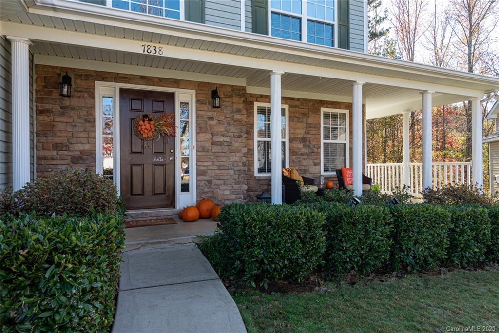 7838 East Berkeley Road Denver, NC 28037 - Photo 2 of 34 front view of a brick house with potted plants