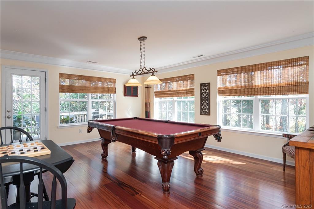7838 East Berkeley Road Denver, NC 28037 - Photo 13 of 34 a view of a dining room with furniture window and wooden floor