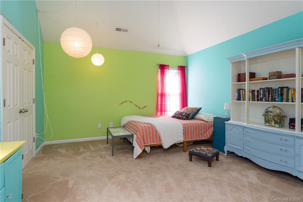 7838 East Berkeley Road Denver, NC 28037 - Photo 18 of 34 a bed room with a bed and a fish tank