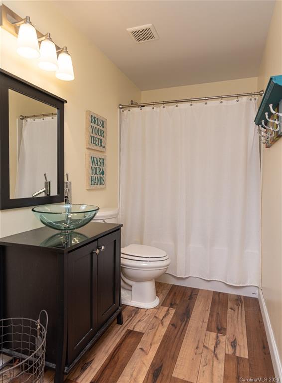 7838 East Berkeley Road Denver, NC 28037 - Photo 28 of 34 a bathroom with a granite countertop sink toilet and shower