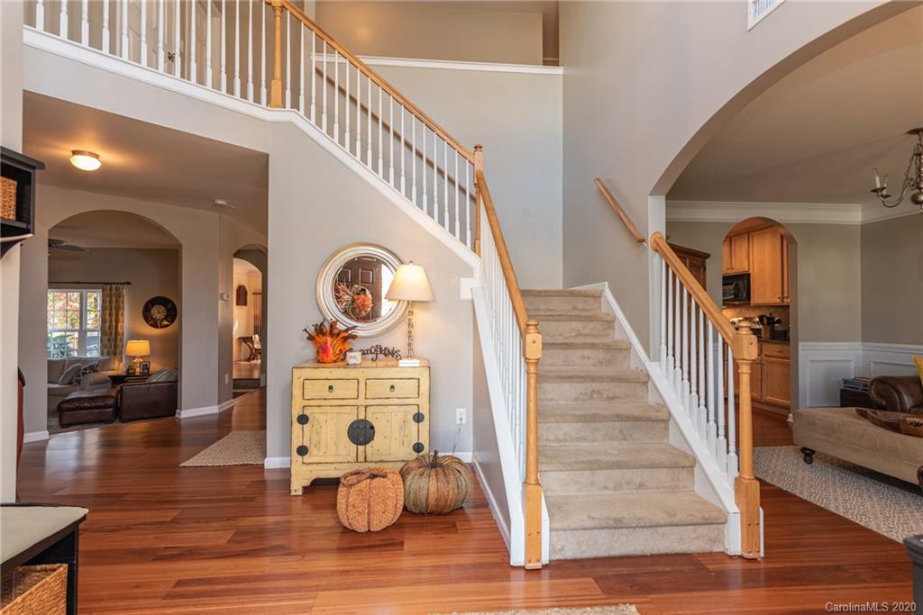 7838 East Berkeley Road Denver, NC 28037 - Photo 5 of 34 a view of entryway livingroom and hall with wooden floor