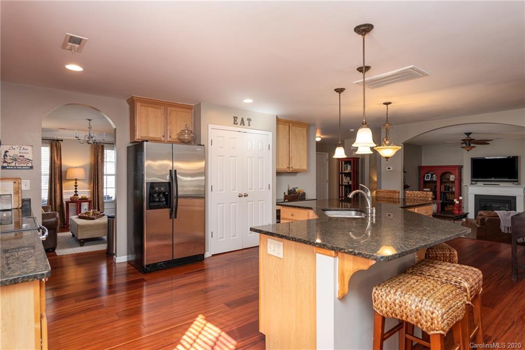 7838 East Berkeley Road Denver, NC 28037 - Photo 10 of 34 wooden floor with kitchen view and living room view