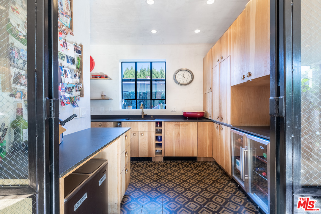 910 Dickson Street Marina del Rey, CA 90292 - Photo 16 of 52 a kitchen with stainless steel appliances granite countertop a refrigerator and a stove