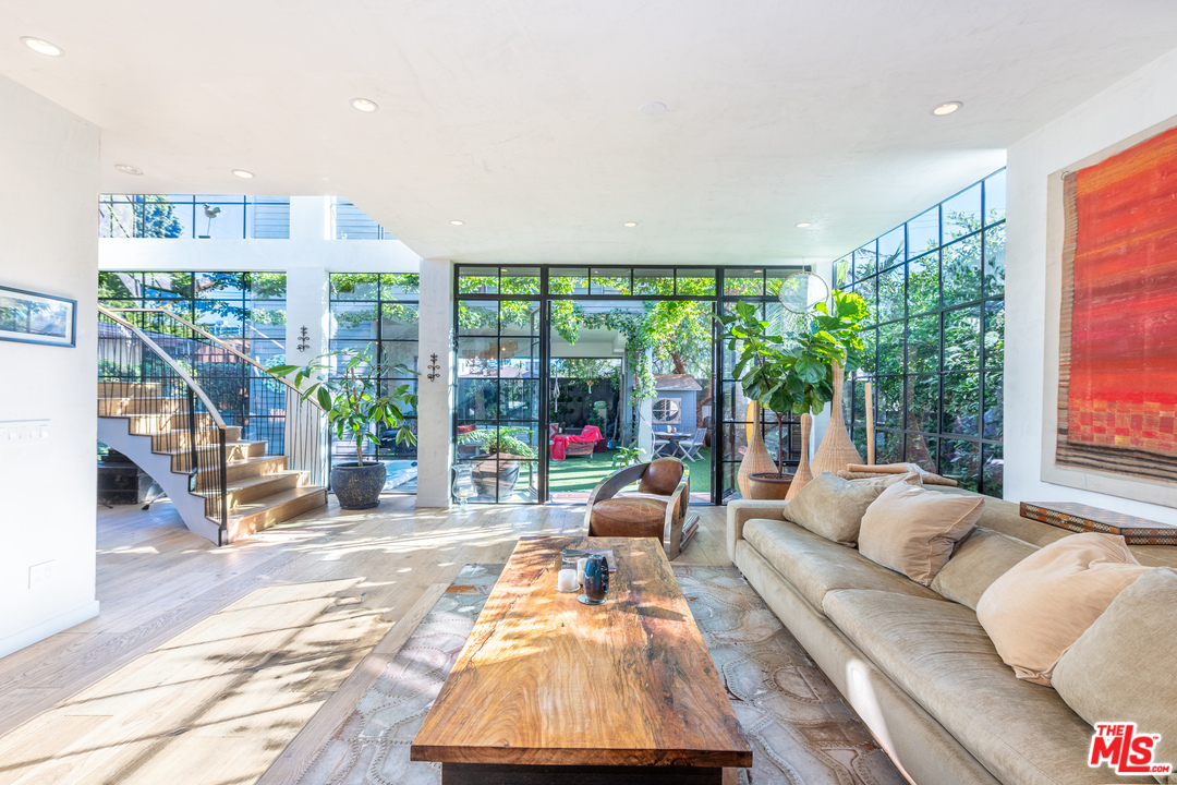 910 Dickson Street Marina del Rey, CA 90292 - Photo 20 of 52 a living room with furniture and a large window